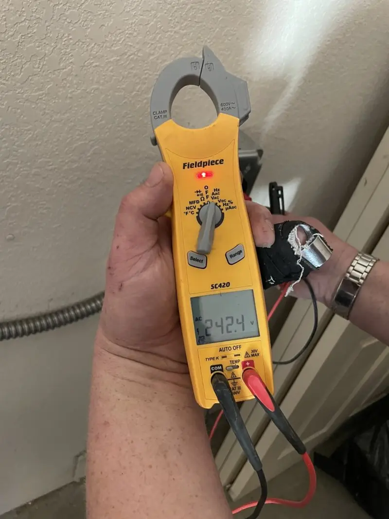 Voltage testing with clamp meter during Outlet Installation in Gulfport